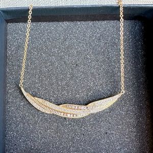 The Danbury Mint gold tone/CZ necklace.